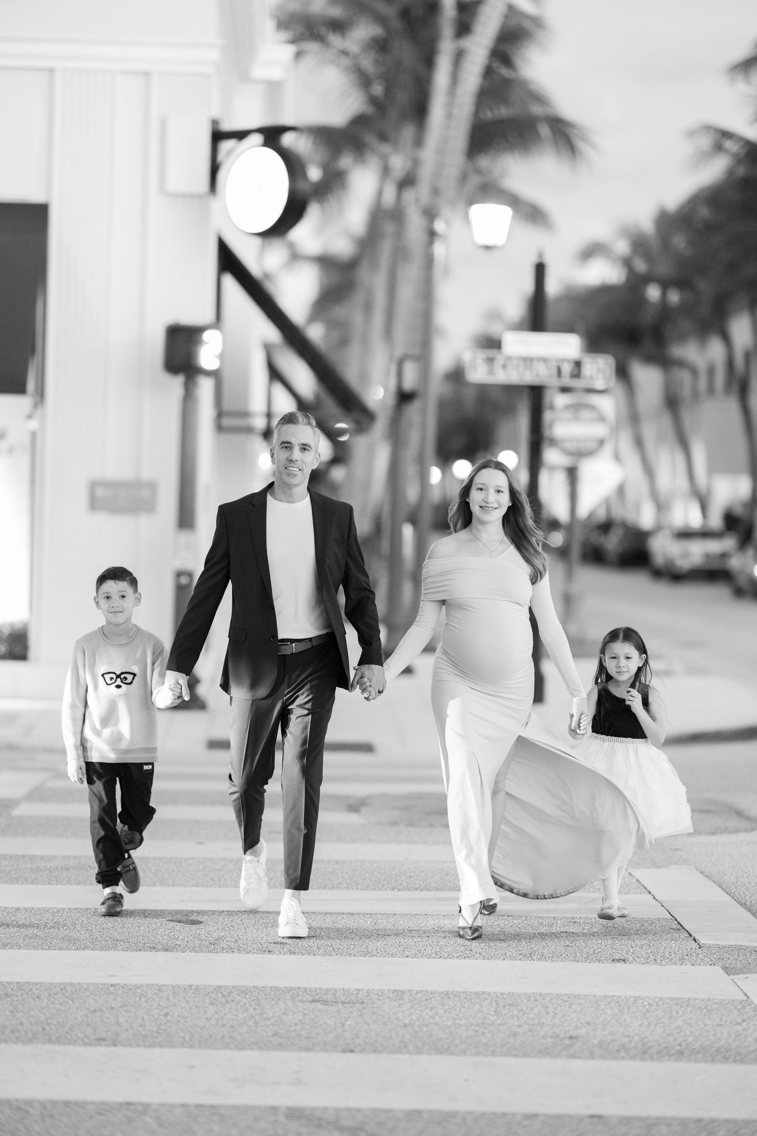 Black and white photo sequence showing people walking along a sidewalk with palm trees in the background.
