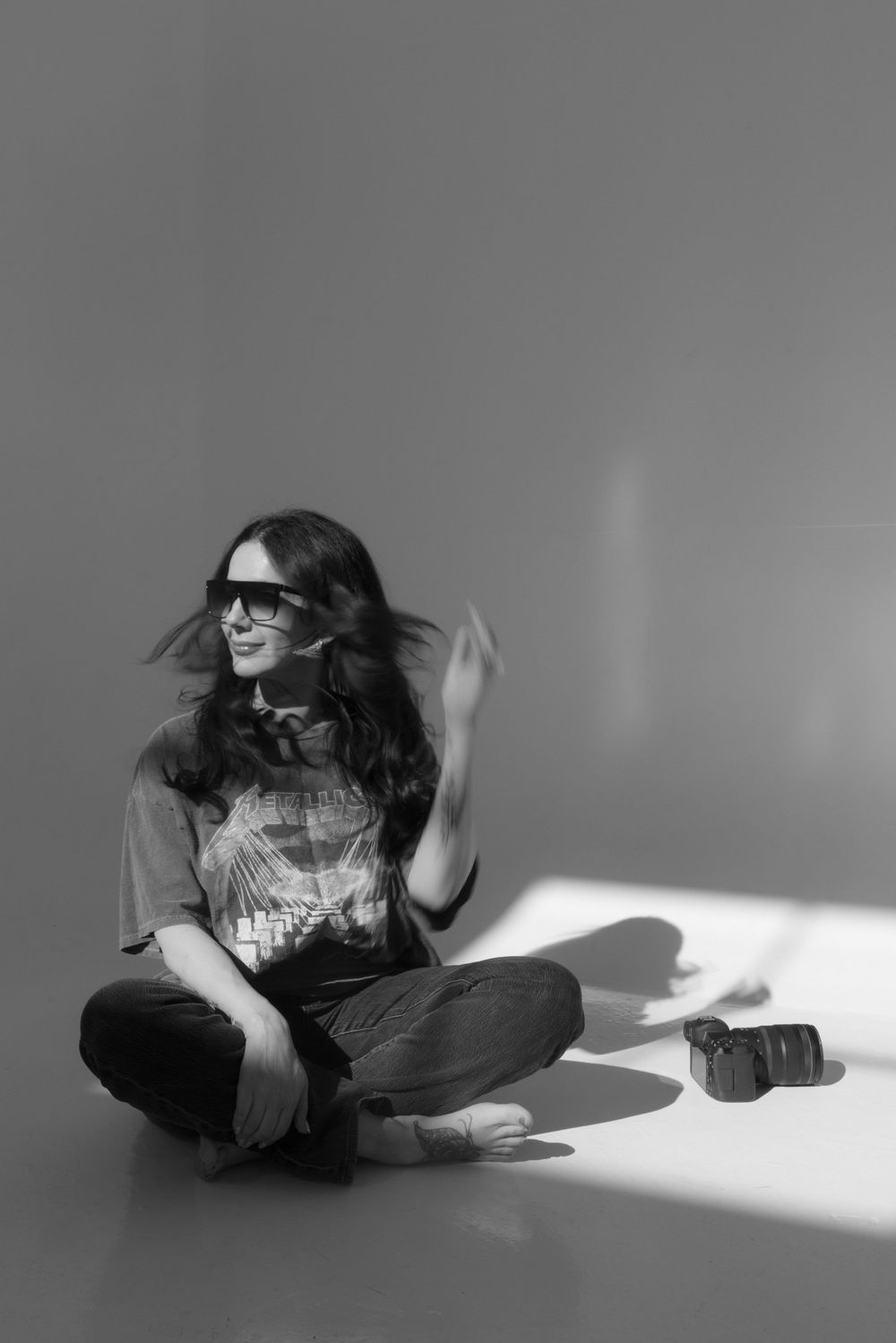 Black and white artistic photo series showing a person lying down in sunlight casting dramatic shadows.