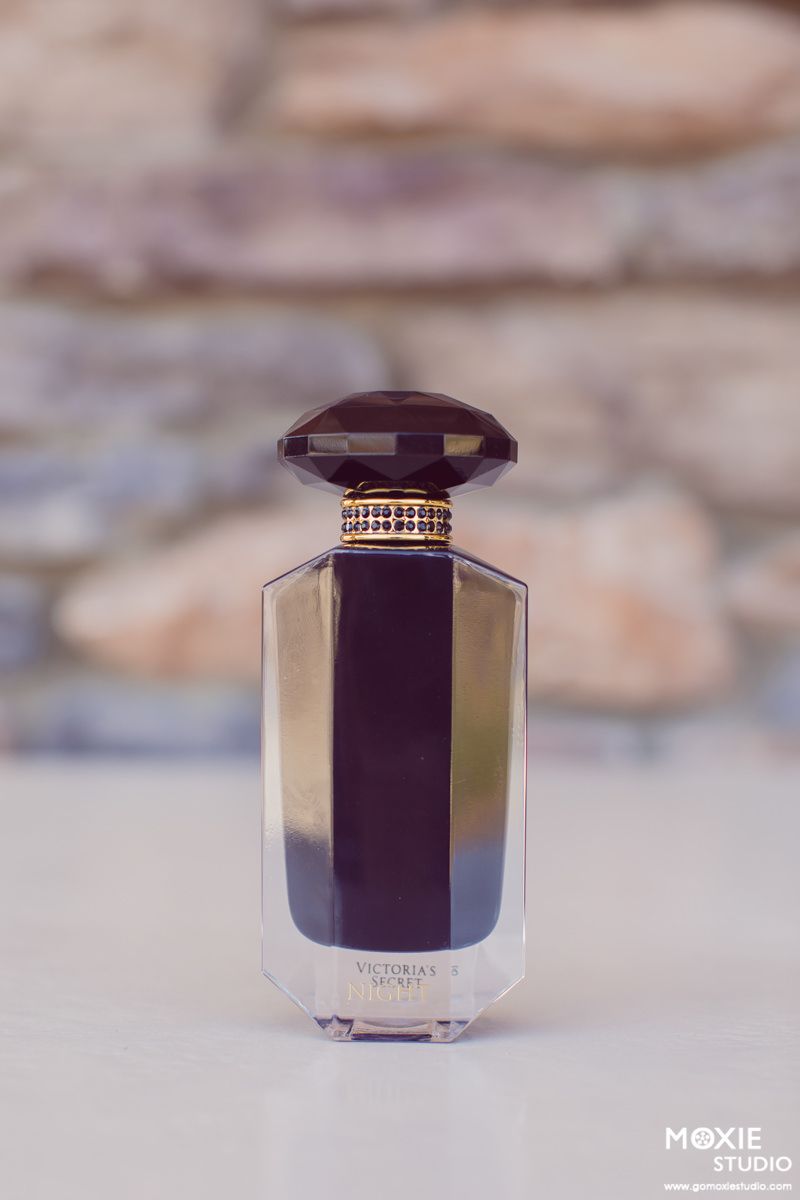 A series of product photos showing a small purple cosmetic jar from different angles against a blurred background.