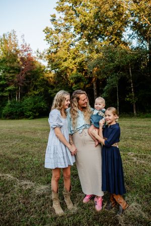 Memphis Family Portrait of homeschool mother and daughters on farm in Collierville, Tennessee during golden hour.