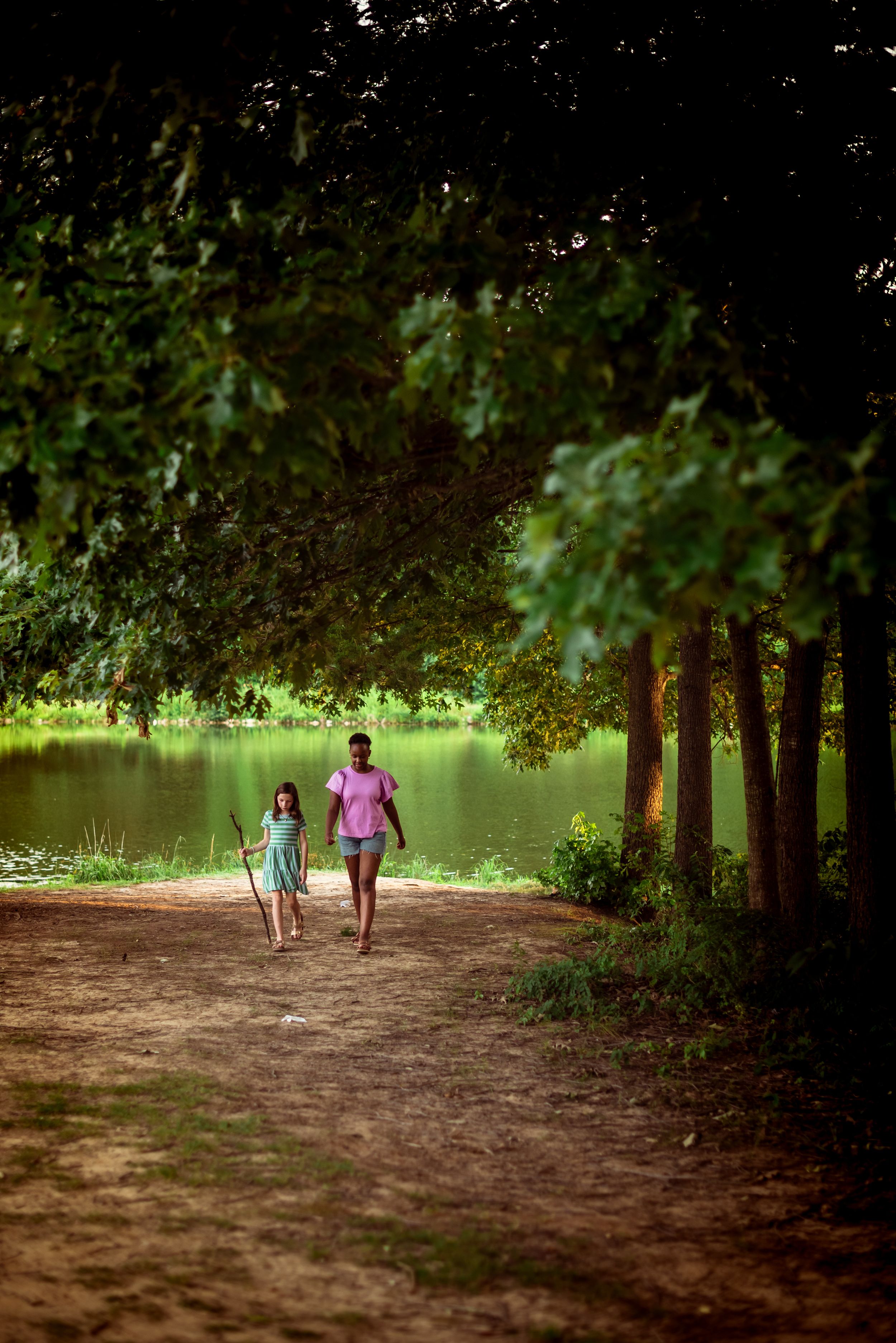 Memphis Family Photographer portrait of sisters at Shelby Farms during Golden Hour.