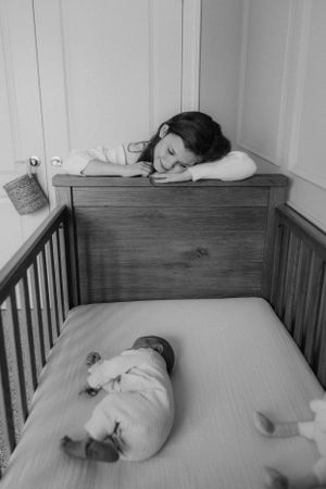 Peaceful nursery scene with sleeping baby in crib.