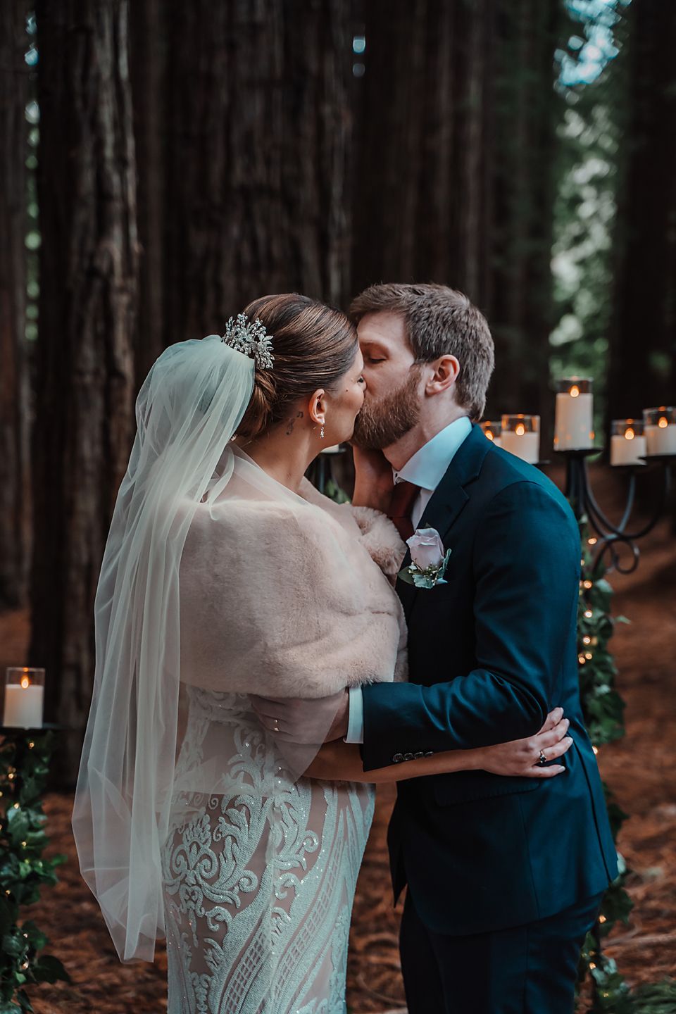 A romantic wedding photo sequence shows a couple kissing in a forest setting with candlelit lanterns and towering trees.