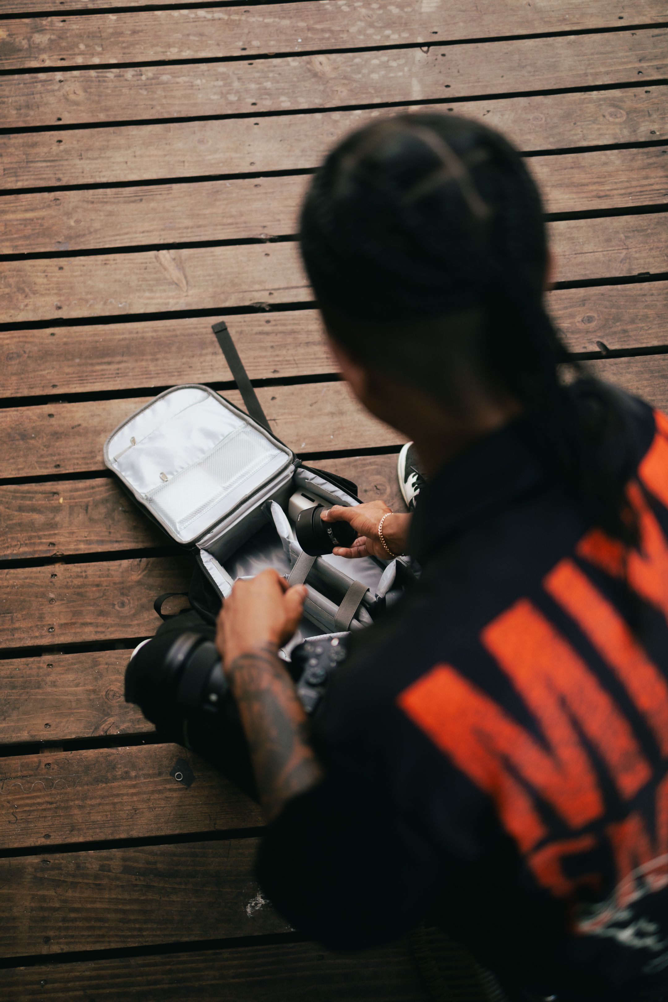 Streetwear editorial in Miami, model writing in journal wearing bold MIXED EMOTIONS hoodie. Cinematic lifestyle portrait for Pinterest.