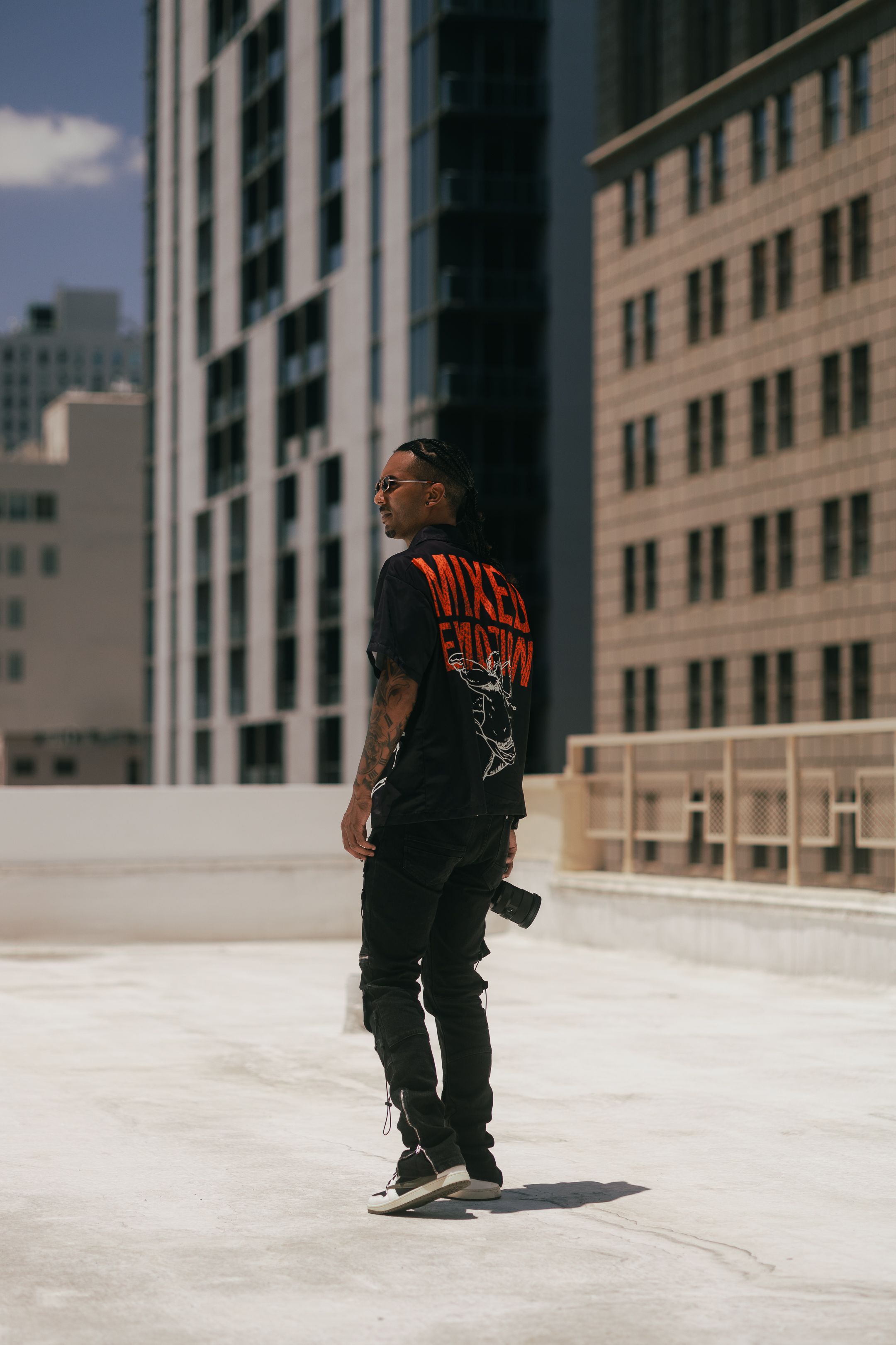 Side profile streetwear portrait in downtown Miami, bold red hair and black fit with Prada-inspired edge, cinematic Pinterest editorial