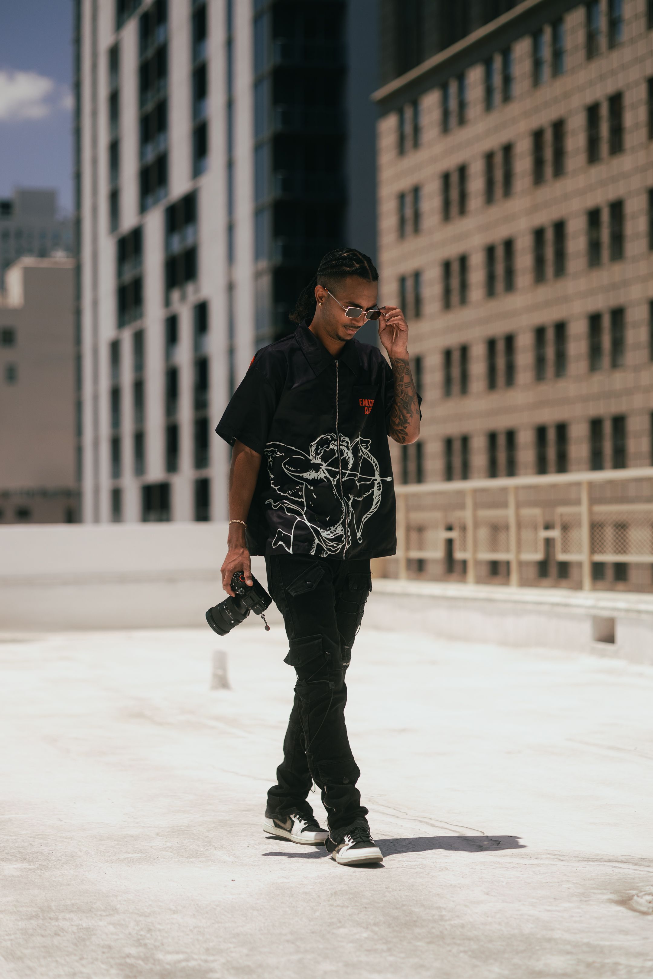 Street fashion portrait in Brickell Miami, model in dark tones styled with Off-White aesthetic. Pinterest-worthy urban editorial session.
