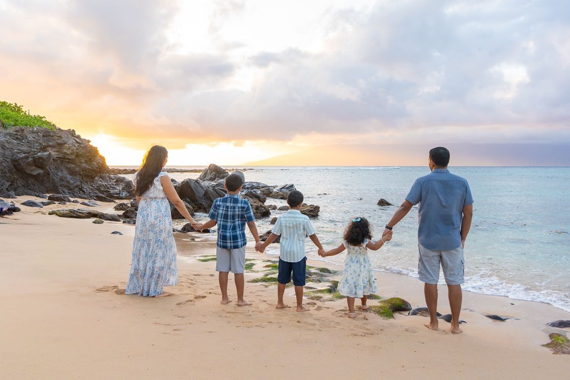 Maui family photographer photo against beautiful Maui sunset beach by ohwowfotos.
