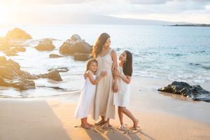 Maui family photographer photo against beautiful Maui sunset beach by ohwowfotos.