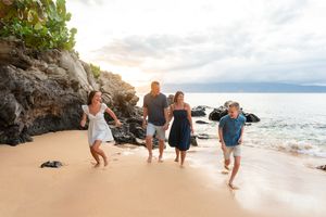 Maui family photographer photo against beautiful Maui sunset beach by ohwowfotos.