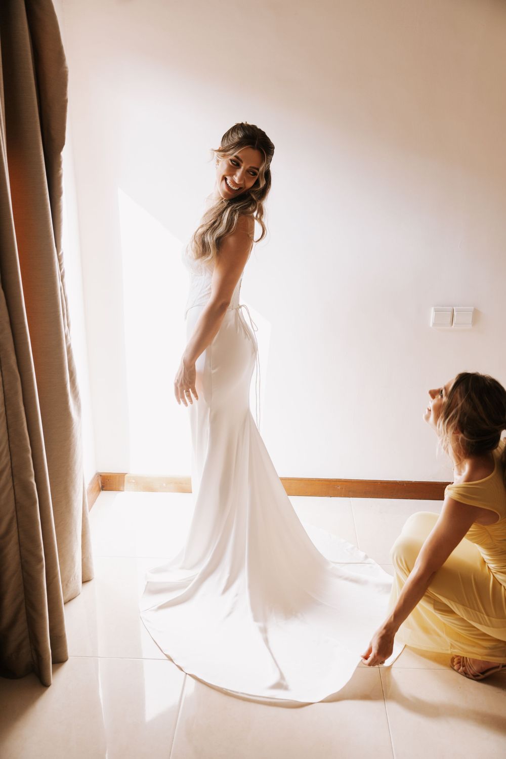 A sequence of five soft, ethereal photos showing graceful dance-like movements against a backlit window with flowing curtains.