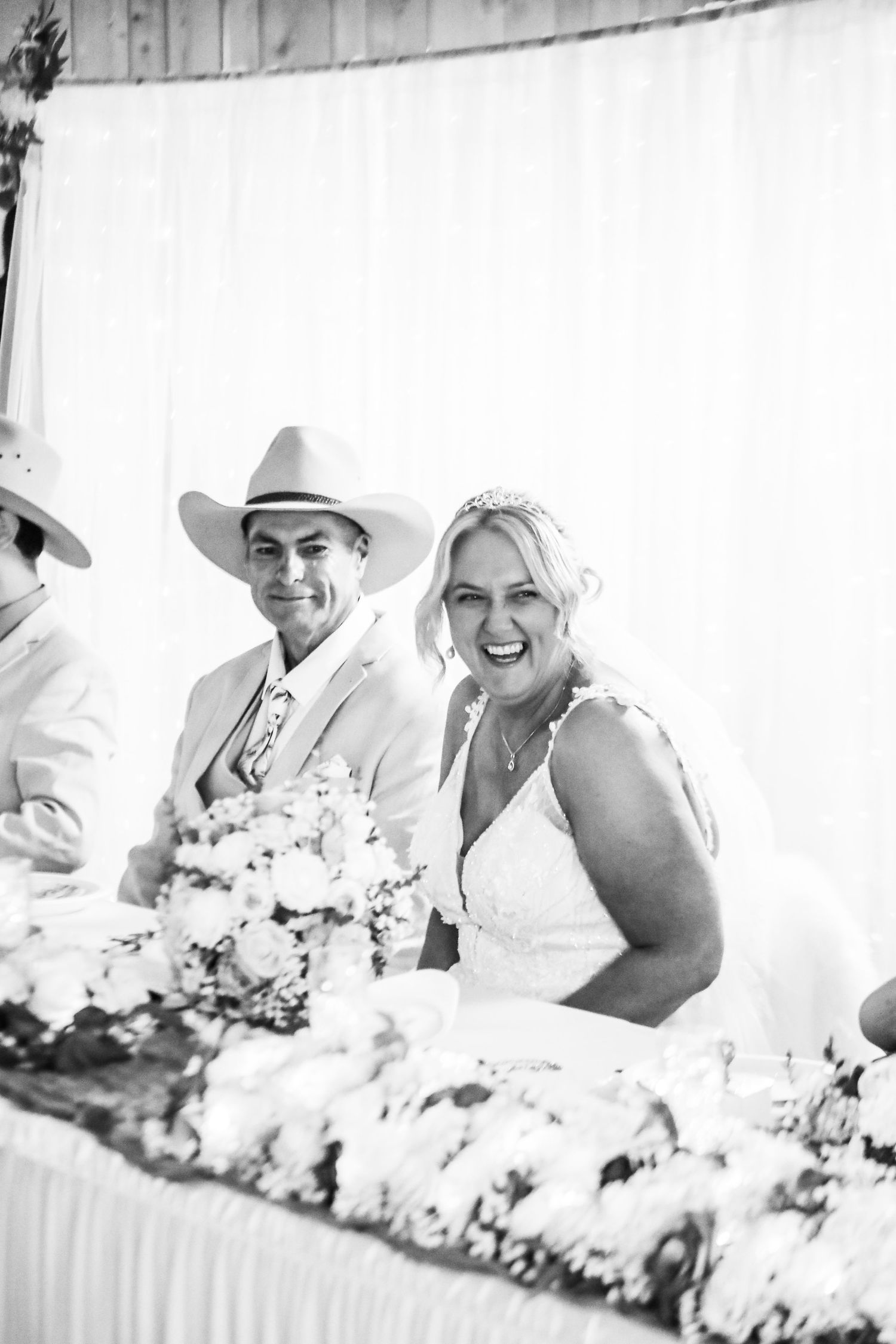 Black and white reception photos showing joyful moments with western theme decor.