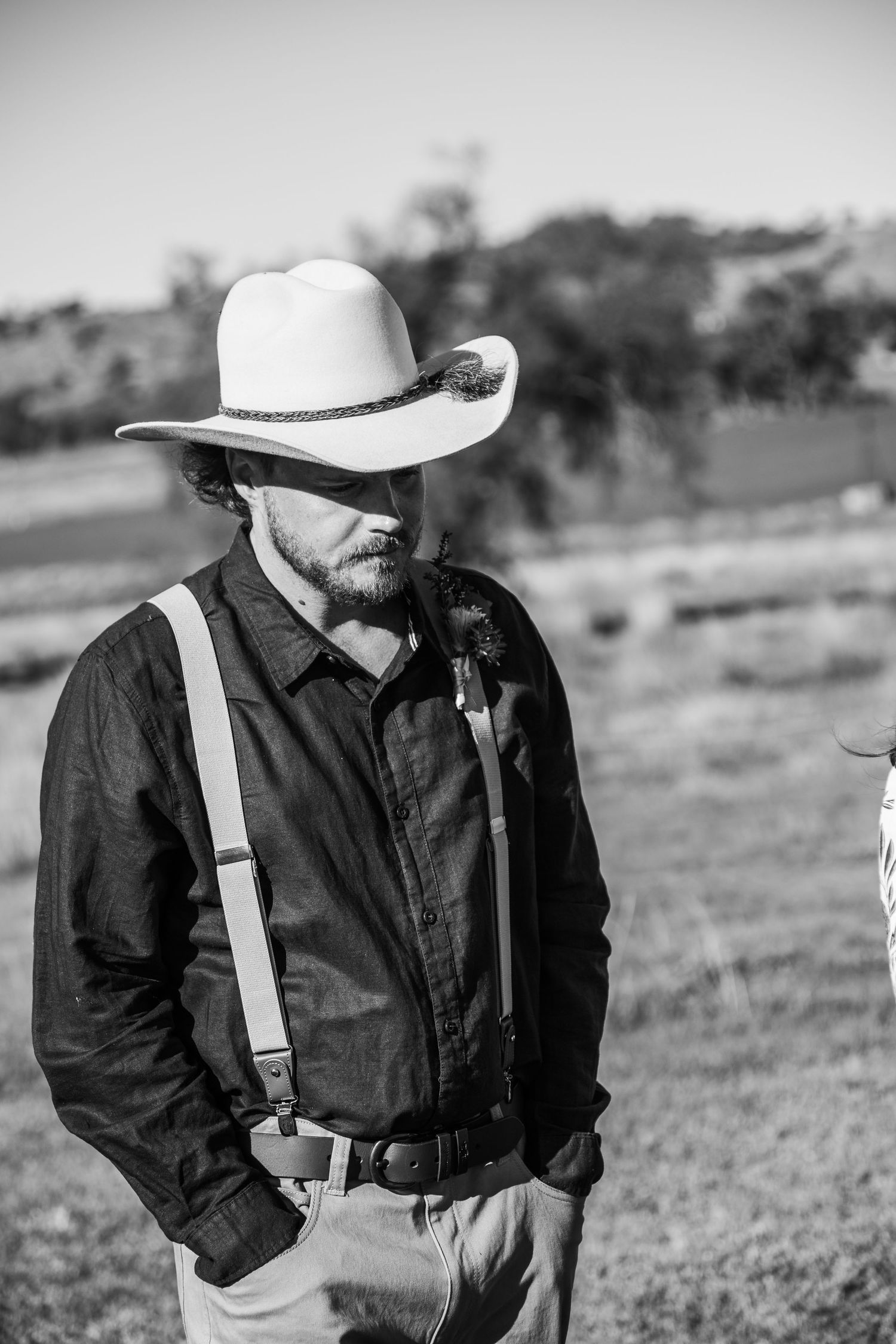 A black and white sequence shows a figure in western attire with suspenders and cowboy hat in multiple poses.