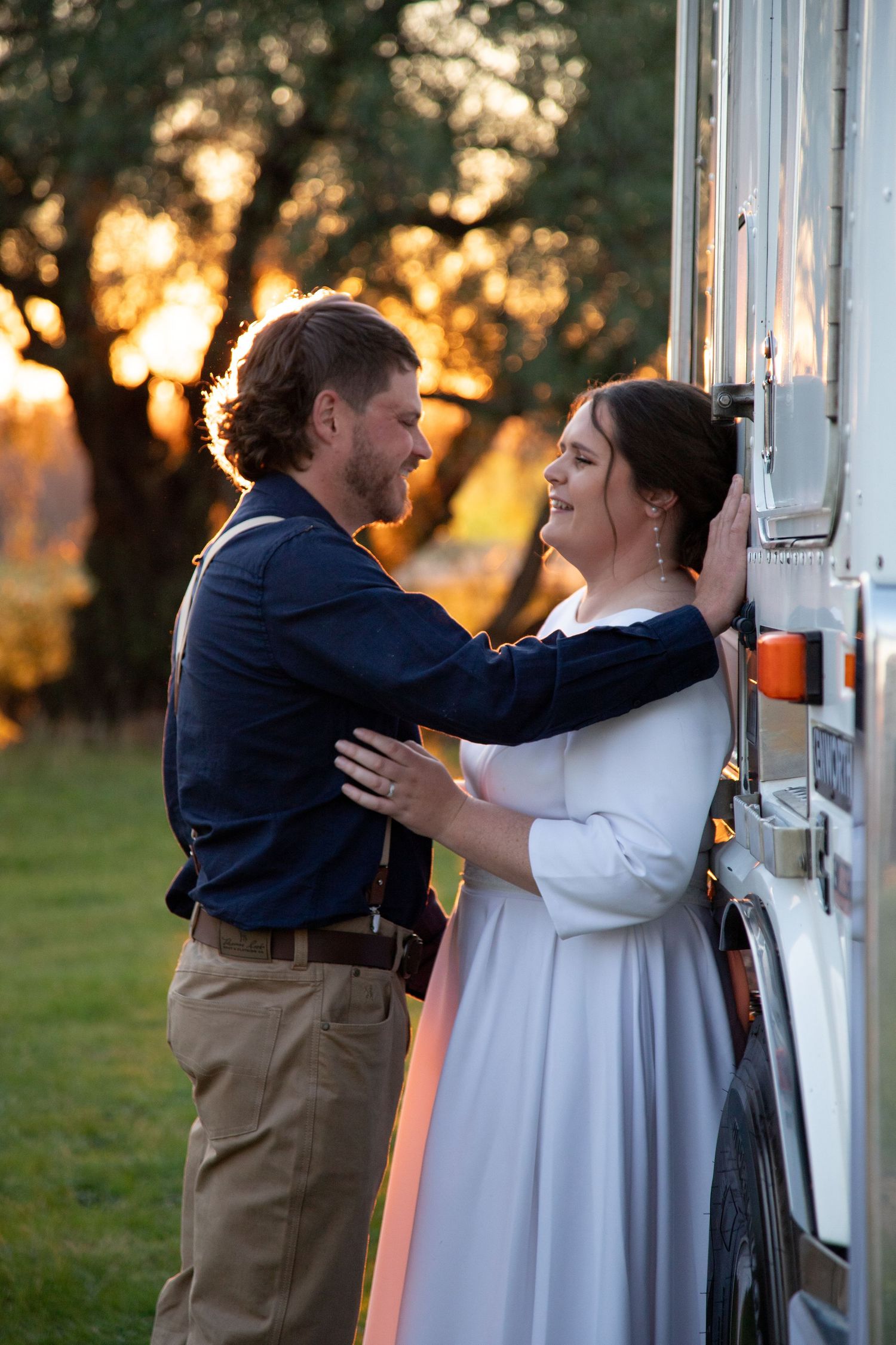 Progressive sequence showing a tender wedding moment against a rustic wall at sunset.