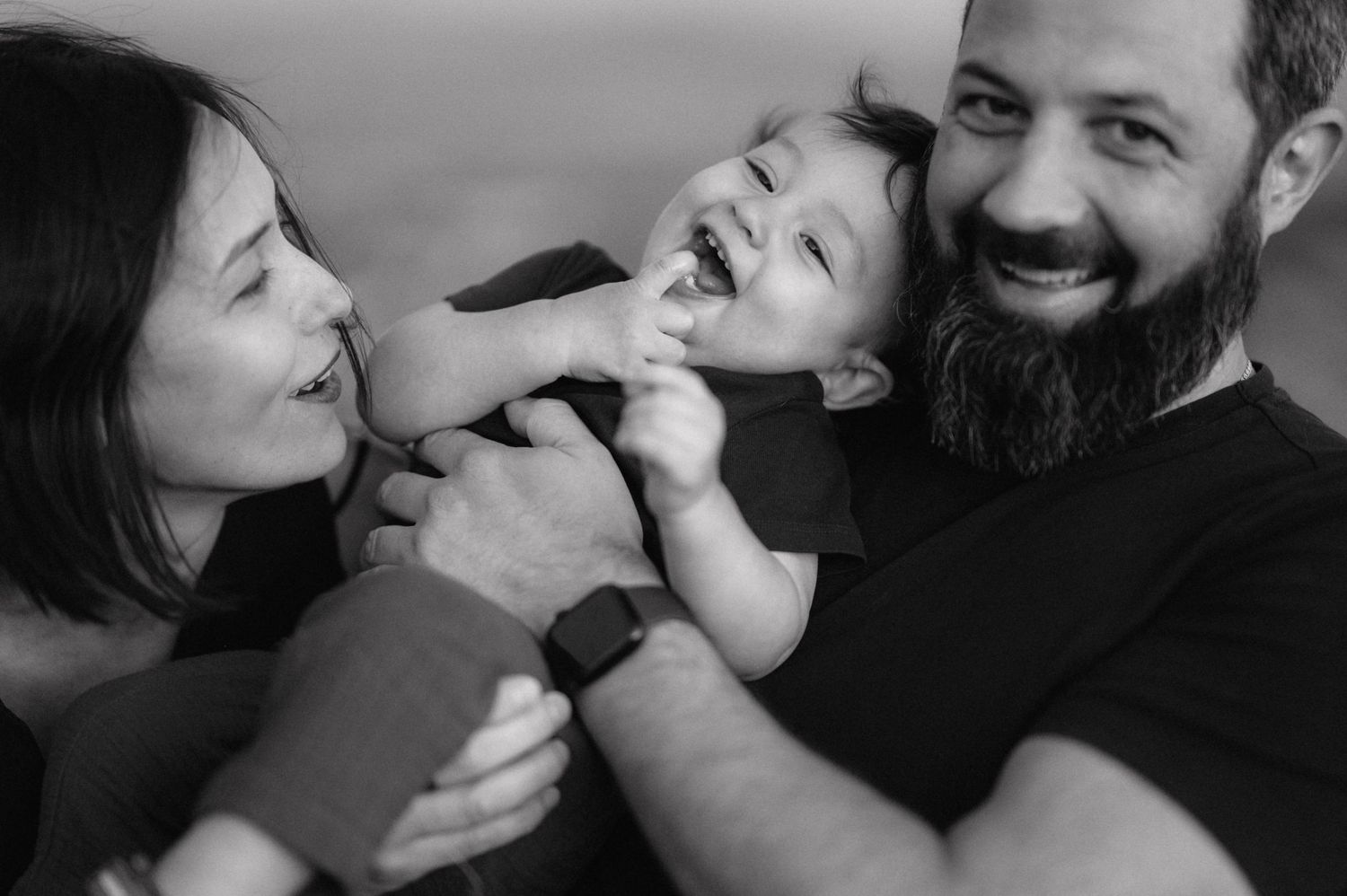 Couple shares intimate moments in a series of casual black and white photographs.