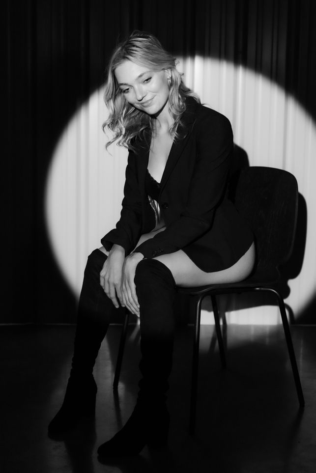 Dramatic black and white portrait series with spotlight effects.