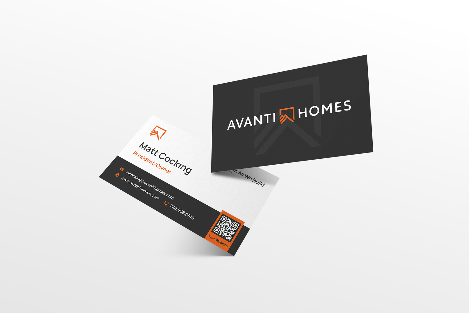 A mockup of modern black and orange business cards for Avanti Homes arranged at an angle on a white surface.