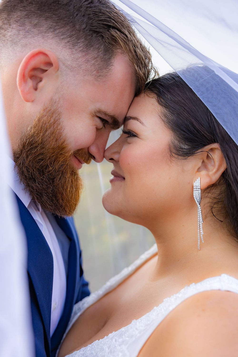 A romantic close-up sequence shows a tender moment between newlyweds sharing intimate glances in wedding attire.