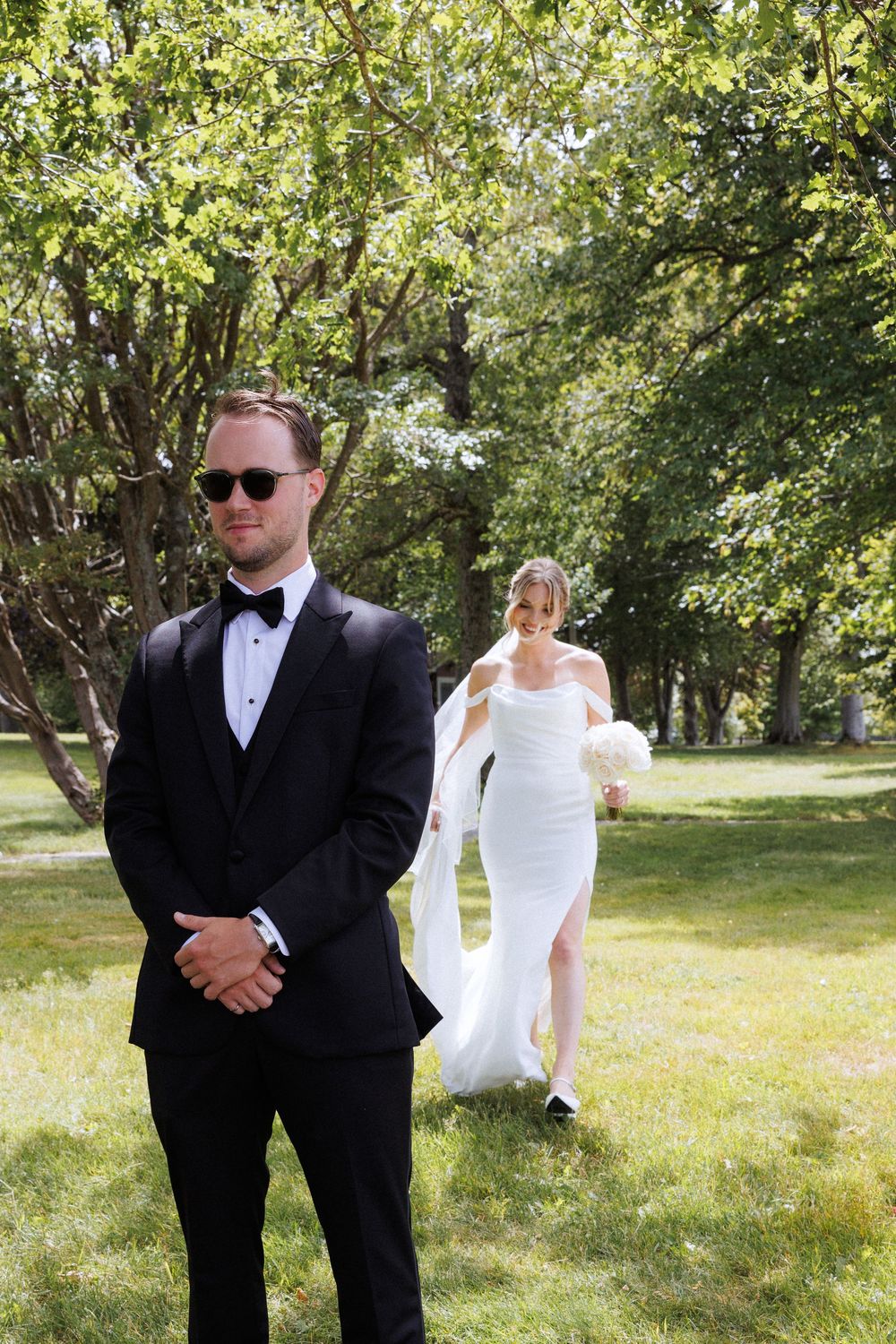 First look on the grounds of Government House during a downtown St. John's wedding captured by wedding photographer Kaitlyn Yvette