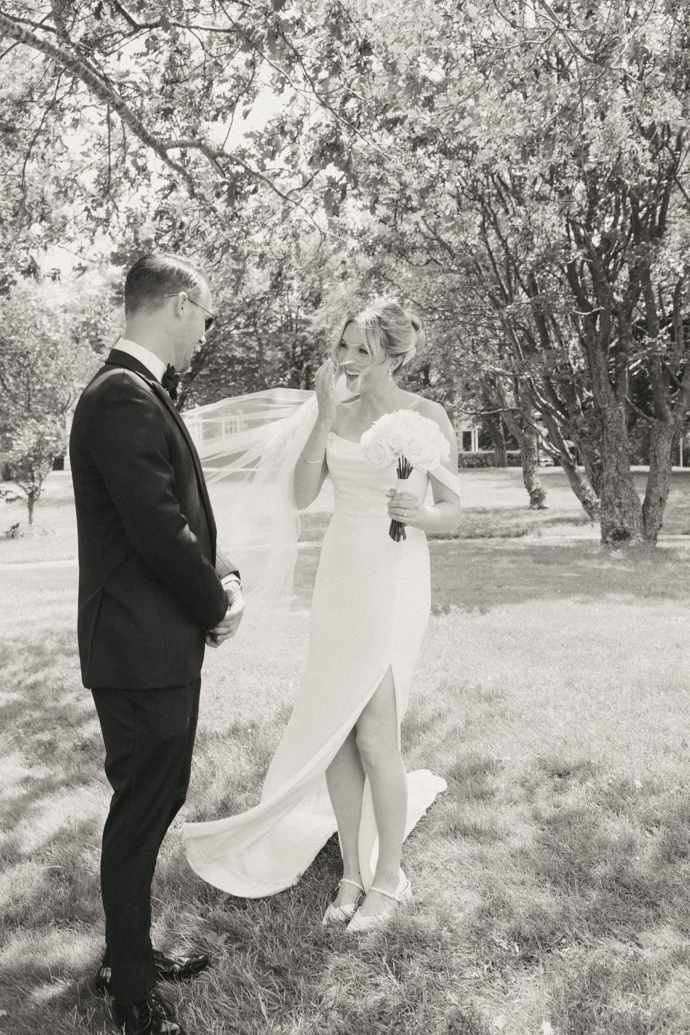 First look on the grounds of Government House during a downtown St. John's wedding captured by wedding photographer Kaitlyn Yvette