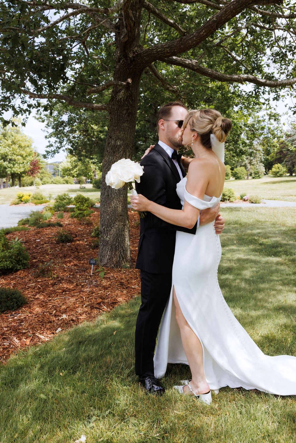 First look on the grounds of Government House during a downtown St. John's wedding captured by wedding photographer Kaitlyn Yvette