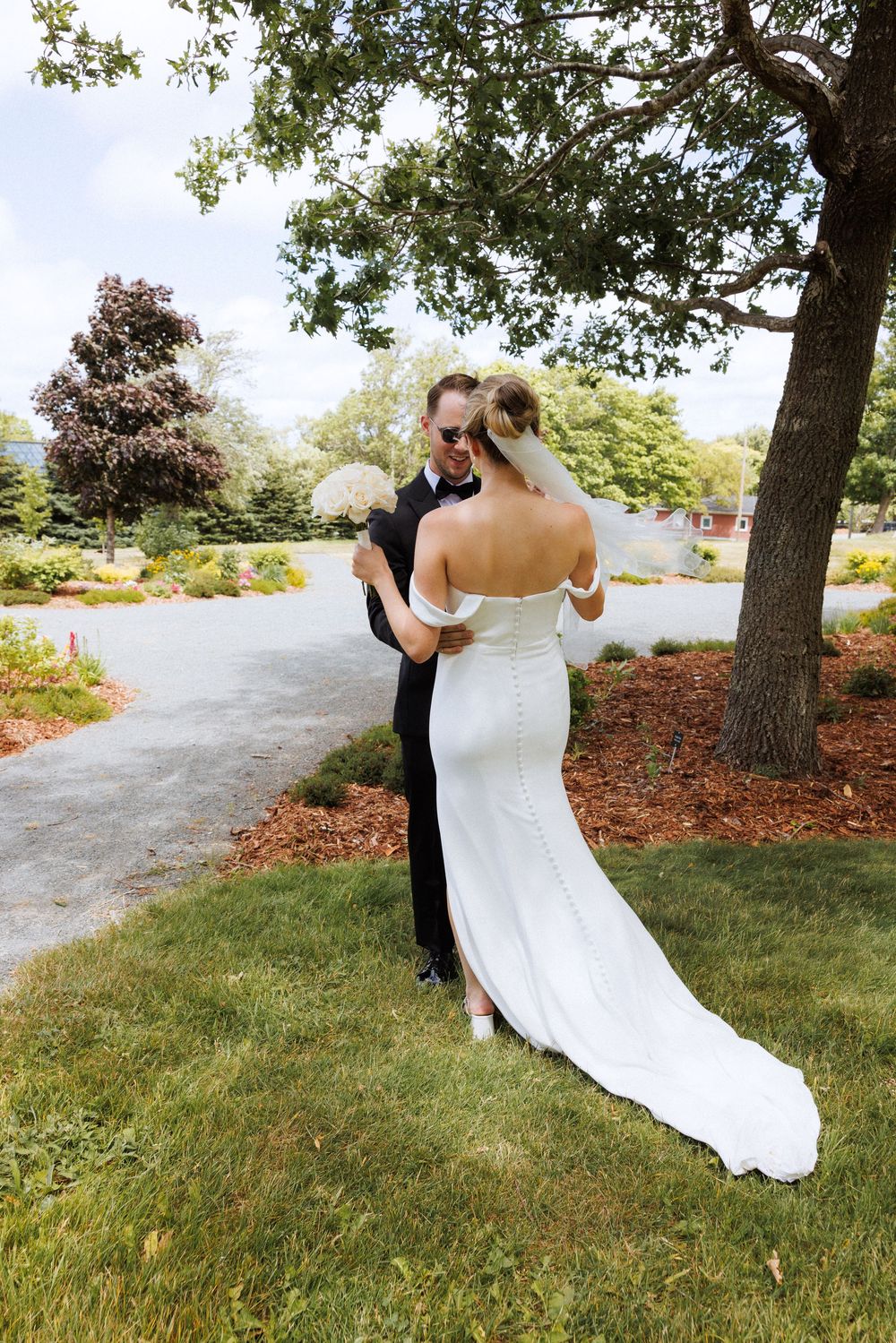 First look on the grounds of Government House during a downtown St. John's wedding captured by wedding photographer Kaitlyn Yvette