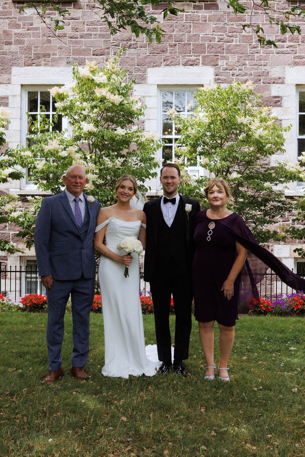 Candid family photos on the grounds of Government House during a downtown St. John's wedding captured by wedding photographer Kaitlyn Yvette