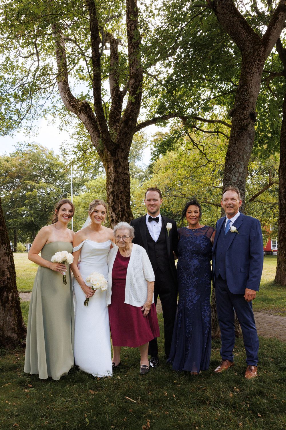 Candid family photos on the grounds of Government House during a downtown St. John's wedding captured by wedding photographer Kaitlyn Yvette