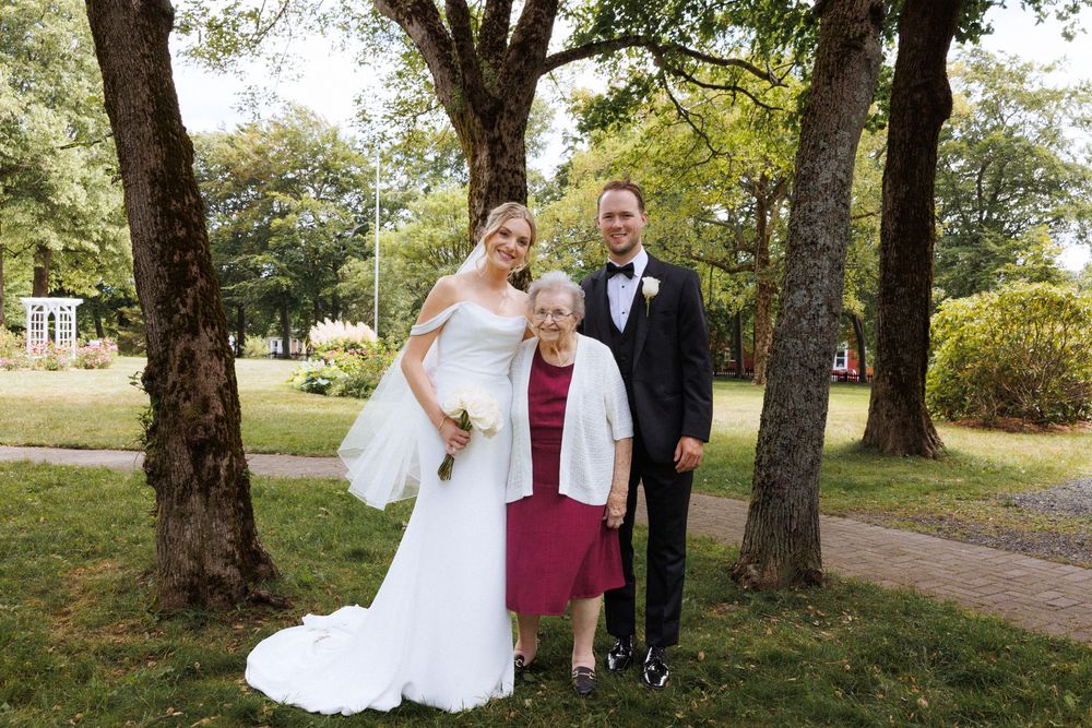 Candid family photos on the grounds of Government House during a downtown St. John's wedding captured by wedding photographer Kaitlyn Yvette