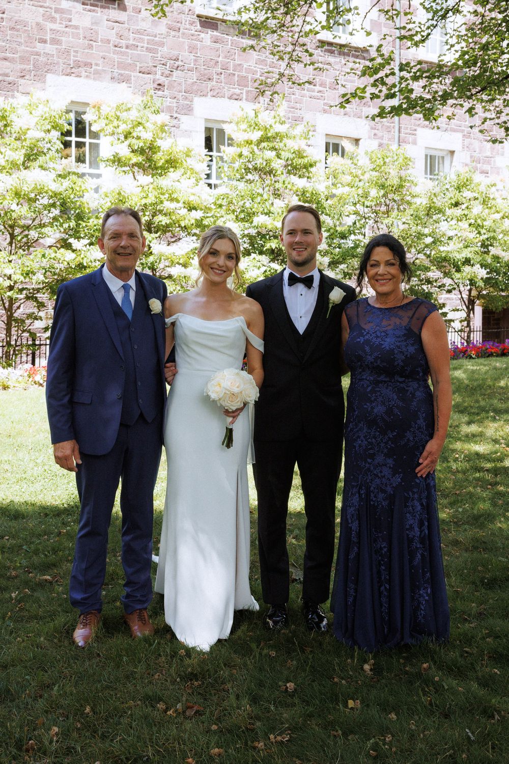 Candid family photos on the grounds of Government House during a downtown St. John's wedding captured by wedding photographer Kaitlyn Yvette