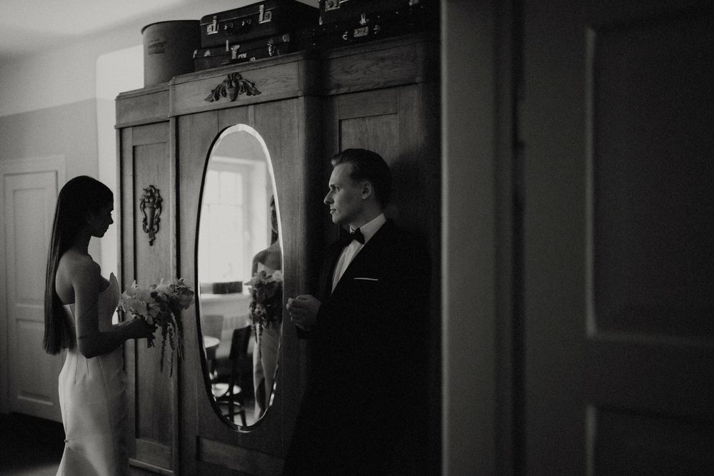 Dramatic black and white interior shots showing silhouettes and reflections.