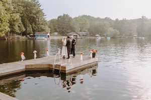 Panoramic view of a serene lake setting during an outdoor wedding.