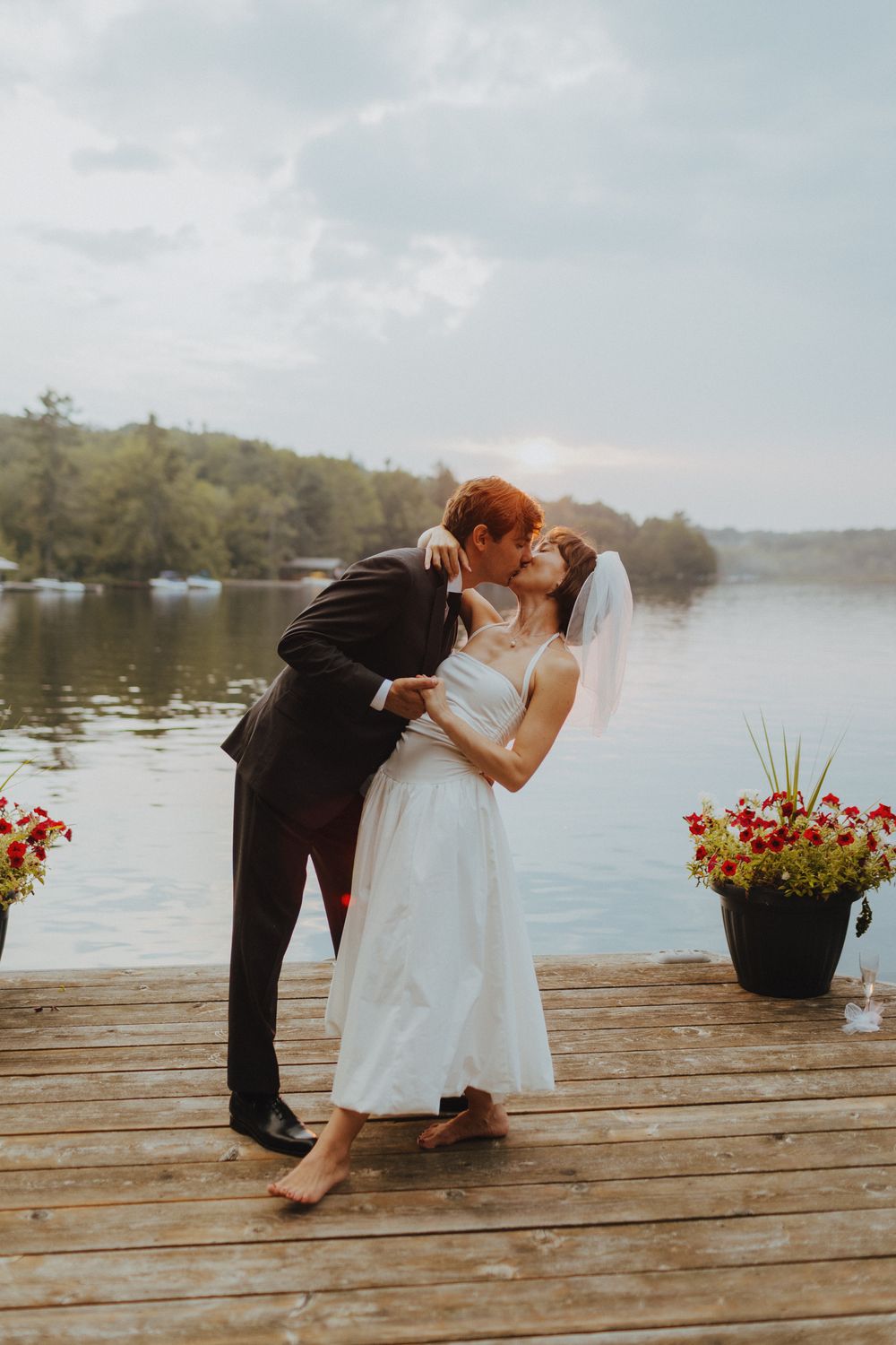 An artistic silhouette photo captured through interior framing during a wedding celebration.