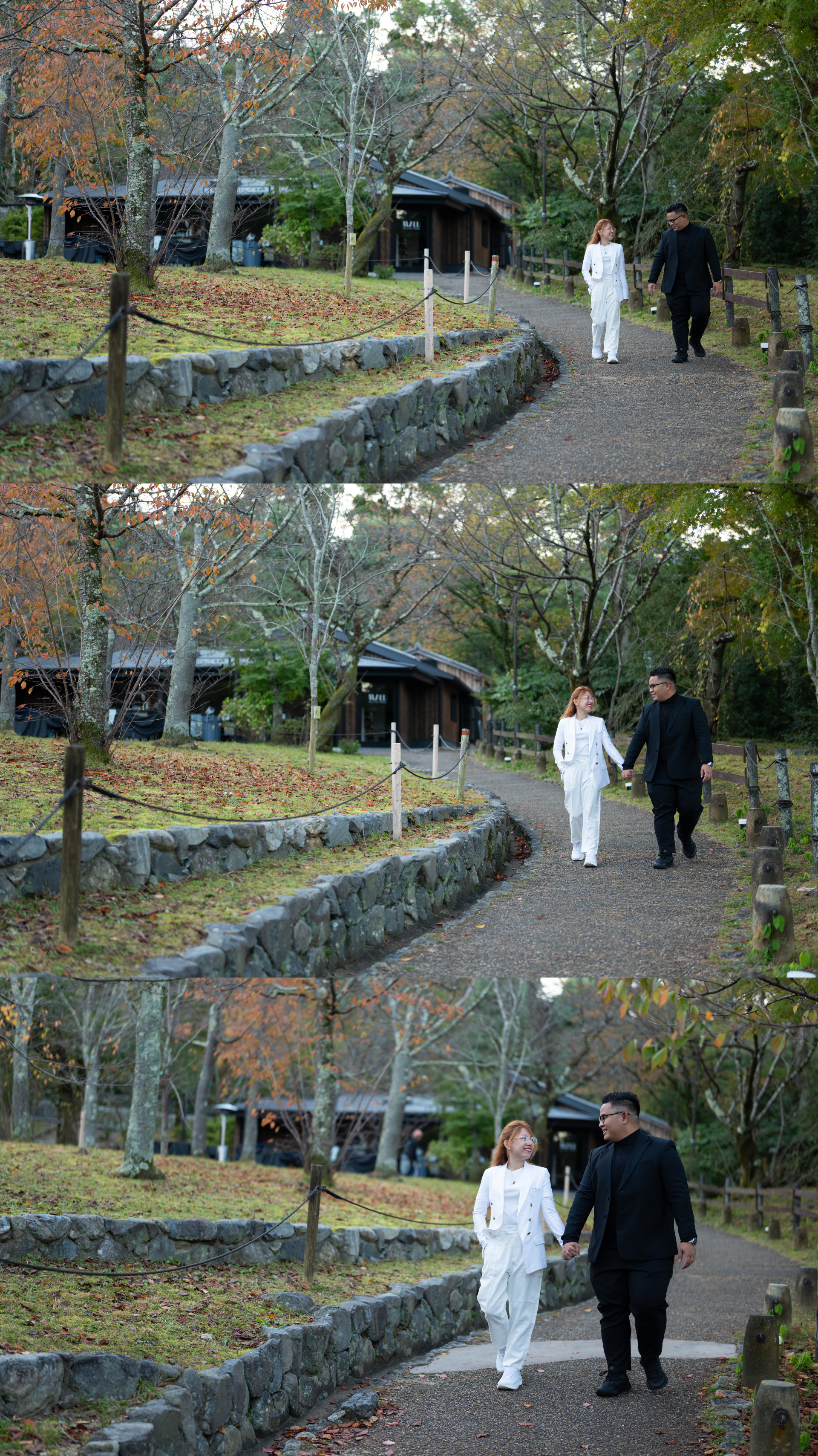 Couple holding hands walking along winding autumn garden path with colorful fall foliage.