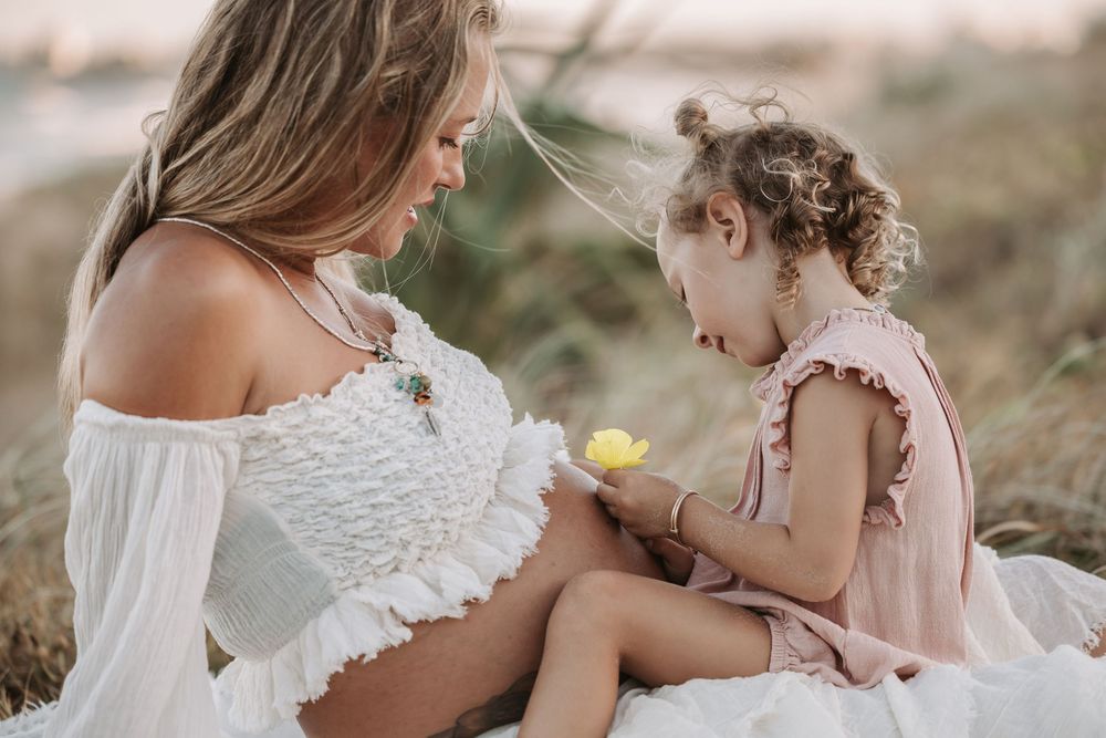 Sunset golden hour Maternity photography session at Mudjima beach on the Sunshine Coast.