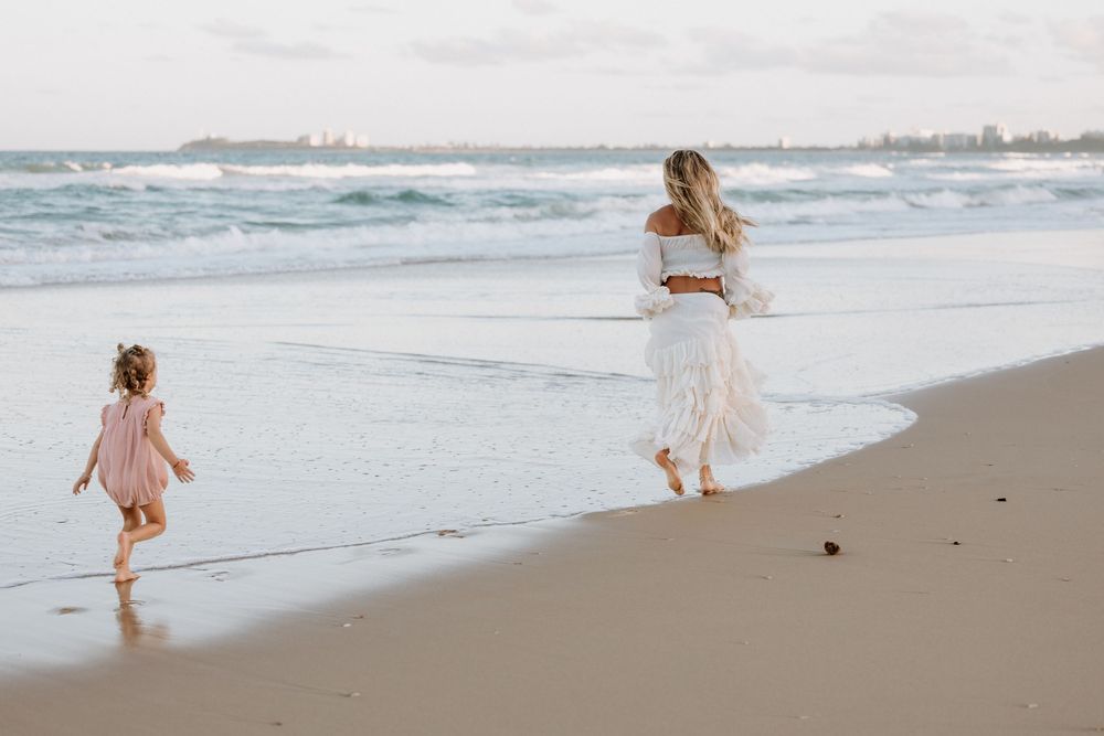 Sunset golden hour Maternity photography session at Mudjima beach on the Sunshine Coast.