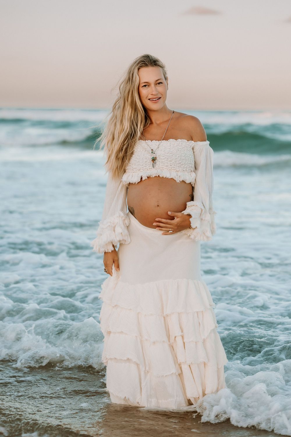 Sunset golden hour Maternity photography session at Mudjima beach on the Sunshine Coast.
