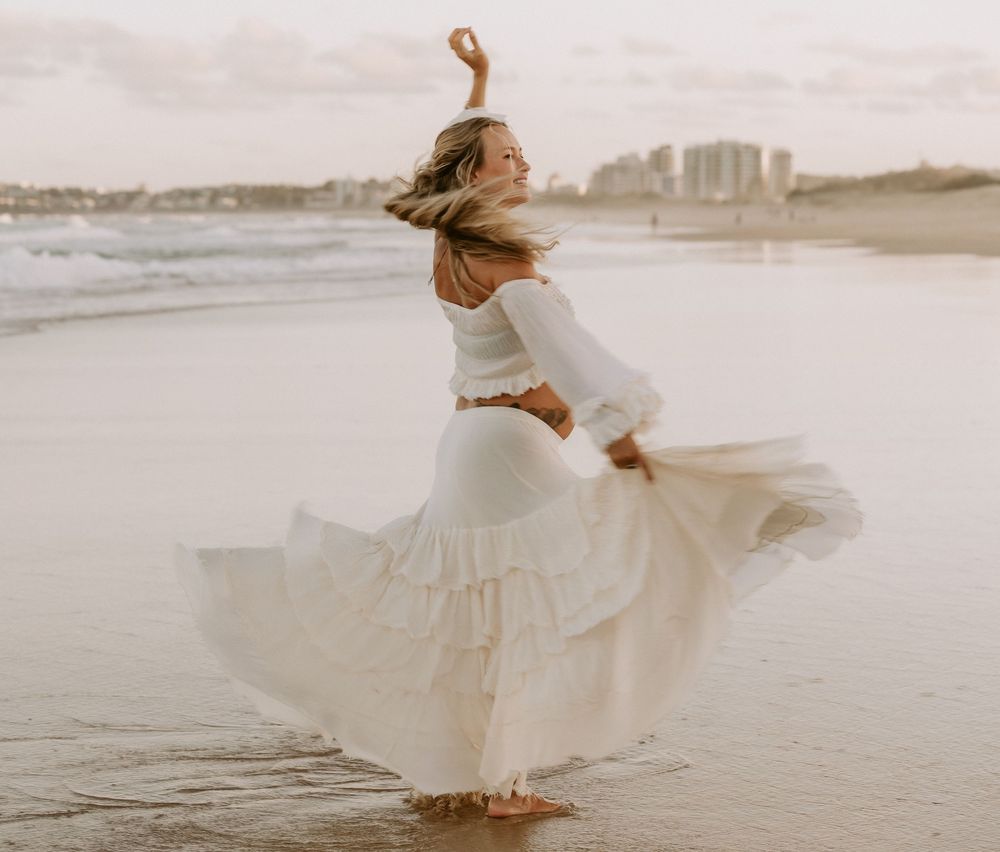 Sunset golden hour Maternity photography session at Mudjima beach on the Sunshine Coast.