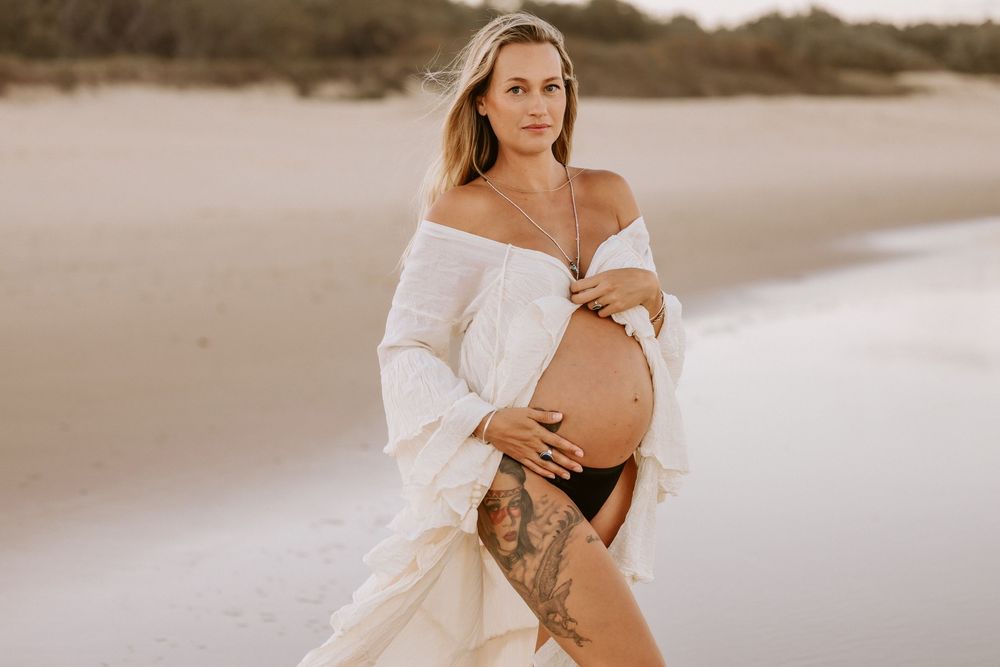 Sunset golden hour Maternity photography session at Mudjima beach on the Sunshine Coast.