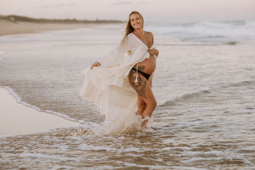 Sunset golden hour Maternity photography session at Mudjima beach on the Sunshine Coast.