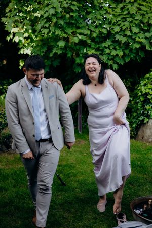 Bride and groom enjoying a sunny wedding day.