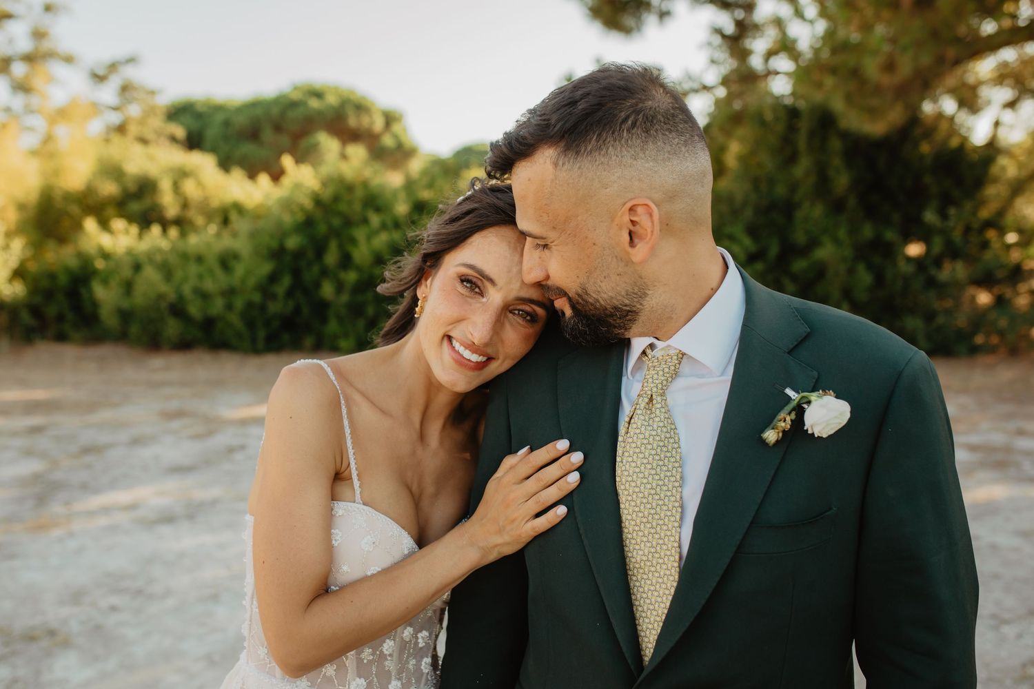 A romantic black and white wedding photo series showing intimate moments between newlyweds in formal attire.