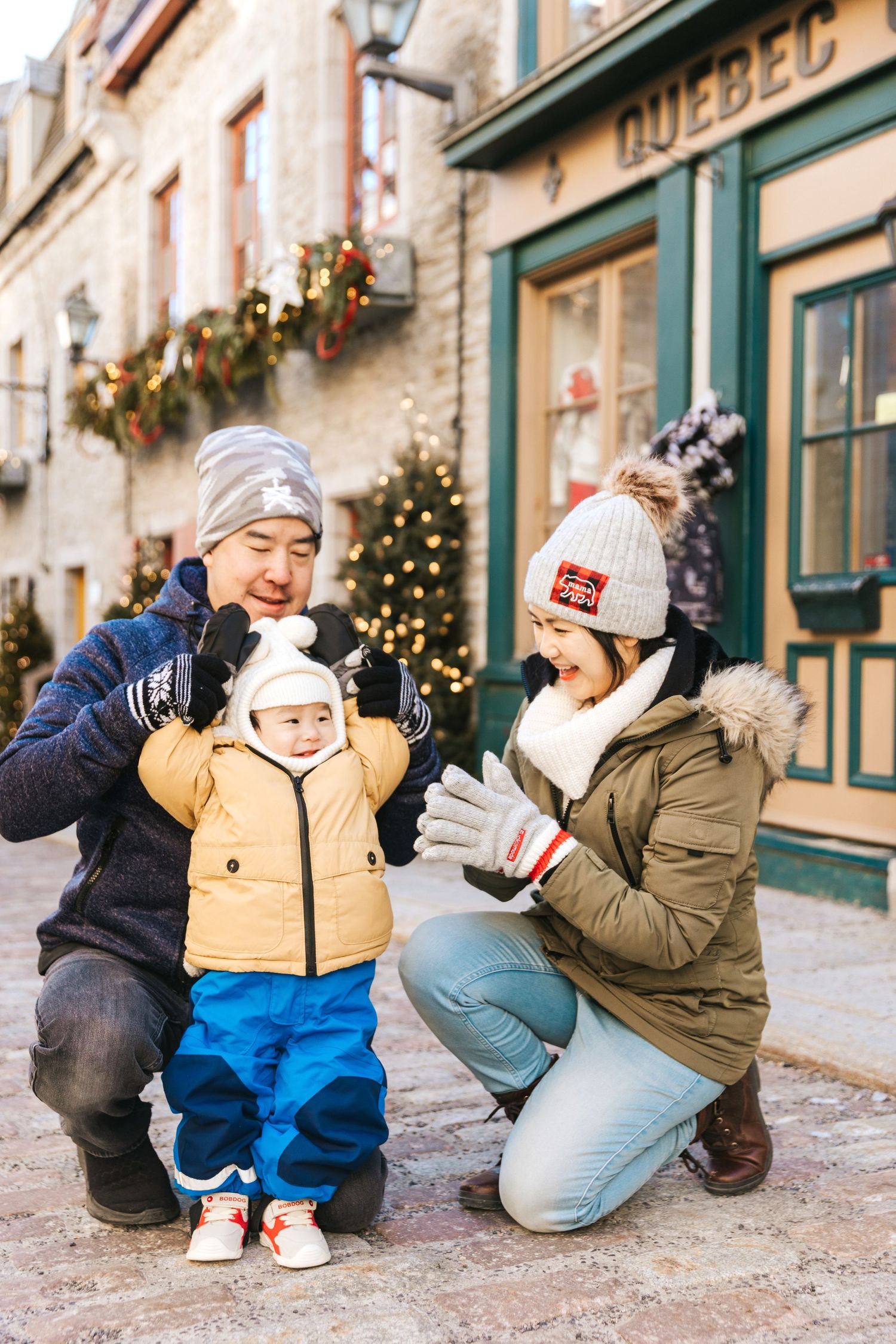 Outdoor winter scene on charming cobblestone street in historic Quebec City.