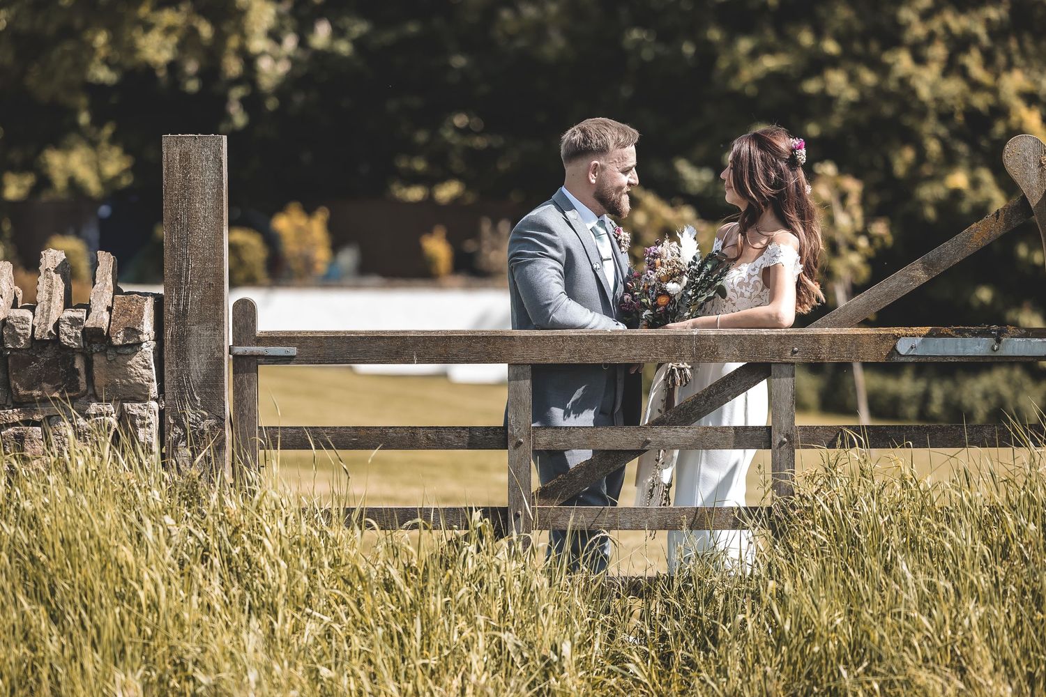 A candid natural moment during wedding day at a barn wedding.