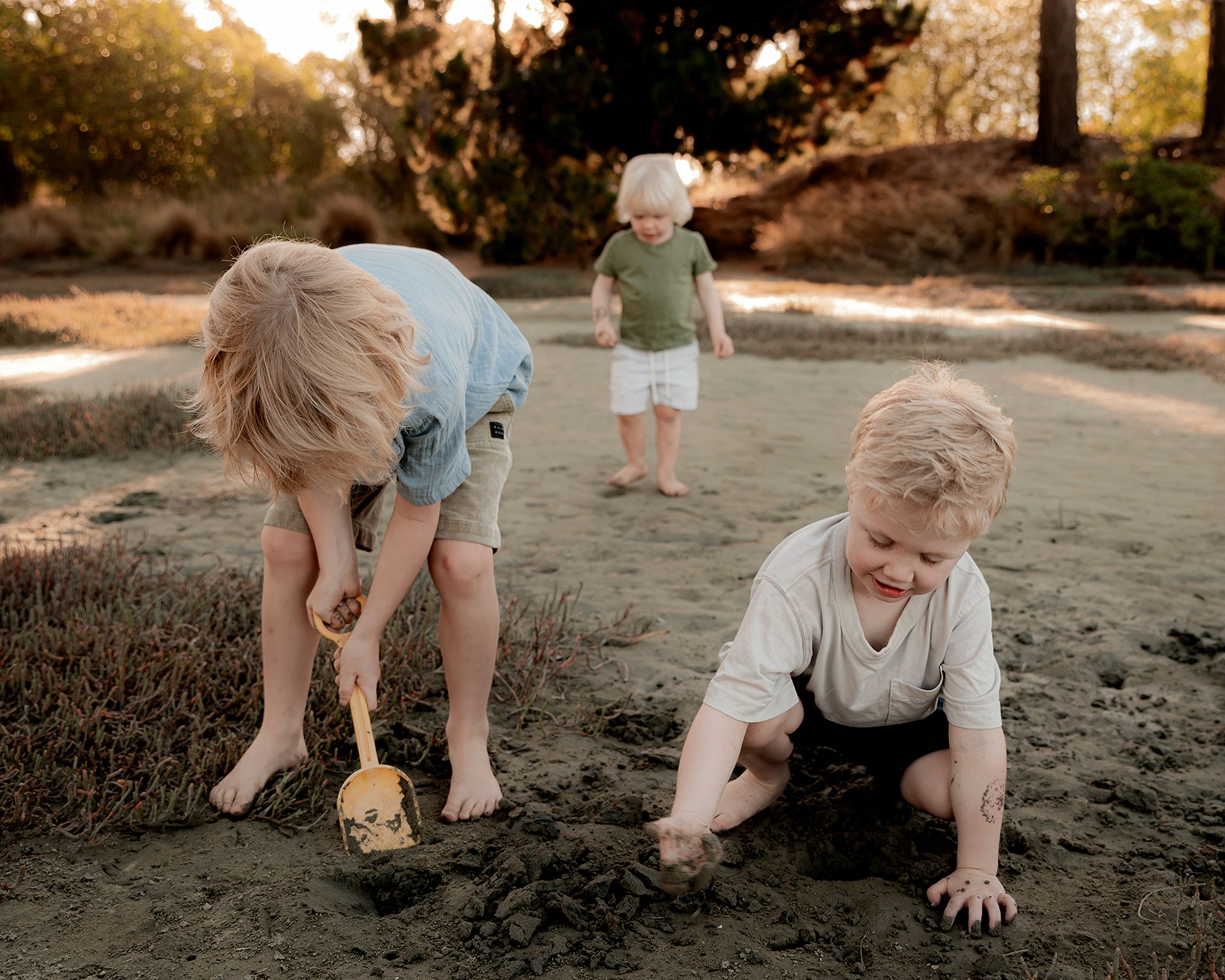Siblings laughing together during portrait session