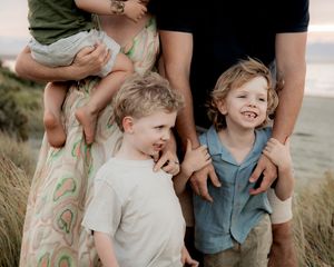 Family embracing during a relaxed photography session
