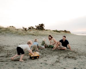 Parents and children sharing a playful moment
