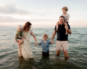 Family gathered together for a natural portrait in the water