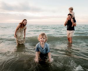 Siblings laughing during family photography session