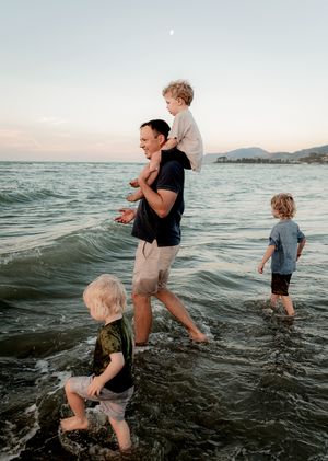 Father holding son during family photoshoot