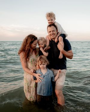 Family of five sharing a quiet moment together